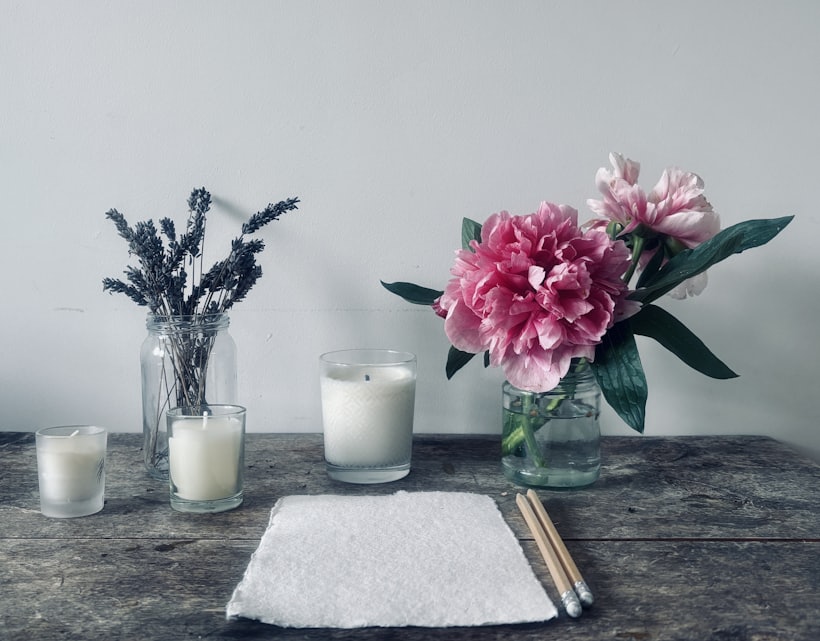 Rolled towels and candles beside the massage table