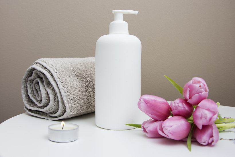 Fresh tulips, towel and lotion