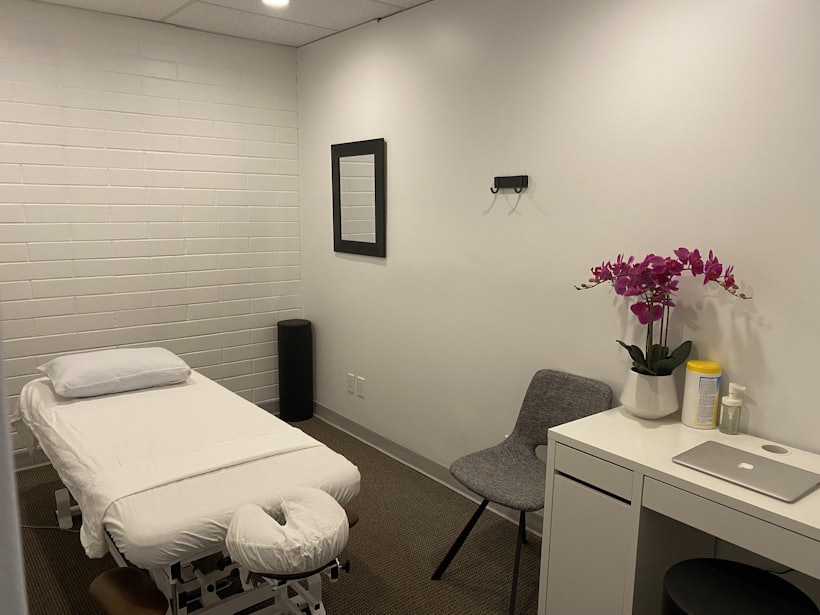 Made-up treatment table with an orchid